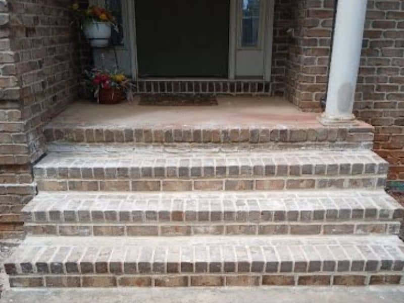 Brick front steps leading to a home entrance